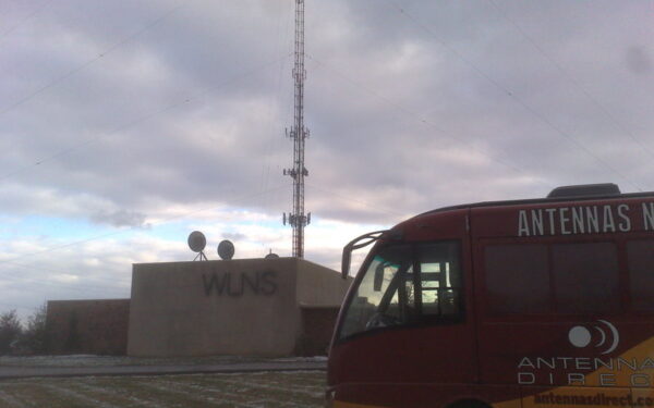 Results image of WLNS TV station with antenna tour bus