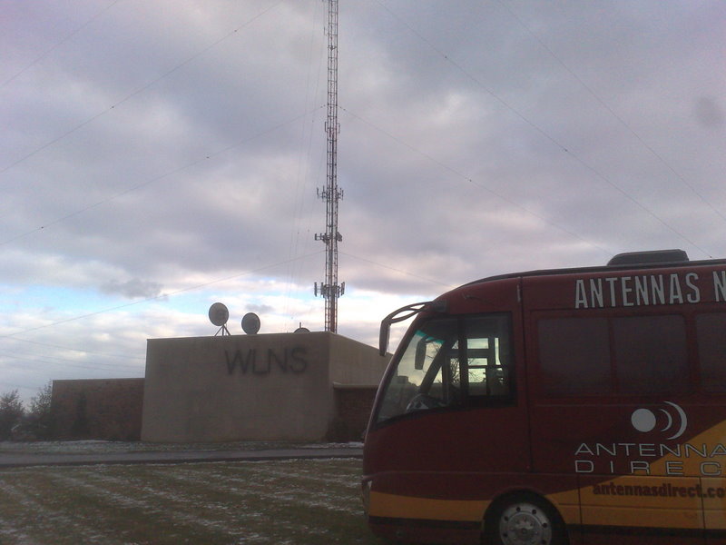 Results image of WLNS TV station with antenna tour bus