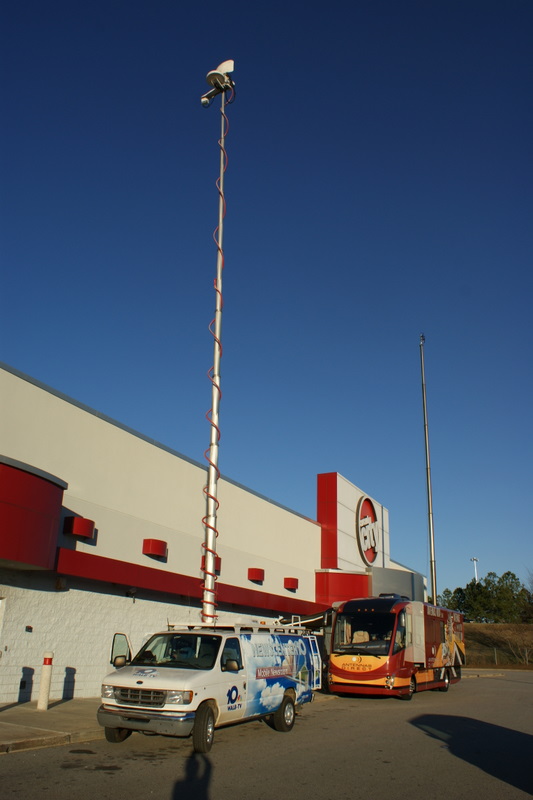 Results image of news van and AD RV in front of Circuit City