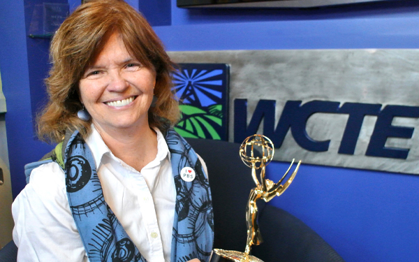 Results image of woman with award at TV station
