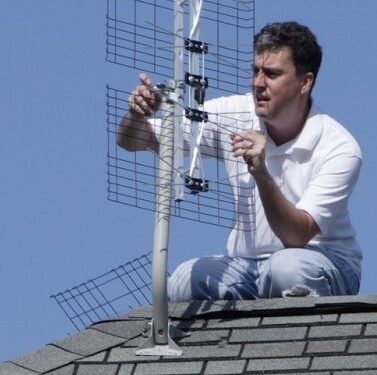 Results image of AD President Richard Schneider installing antenna on roof