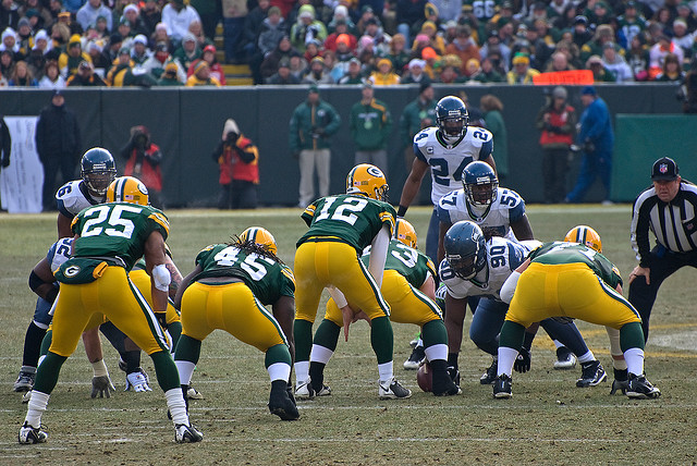 Results image of NFL players green and yellow uniforms