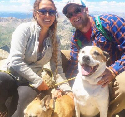 Results image of founder Making Sense of Cents with husband and dogs