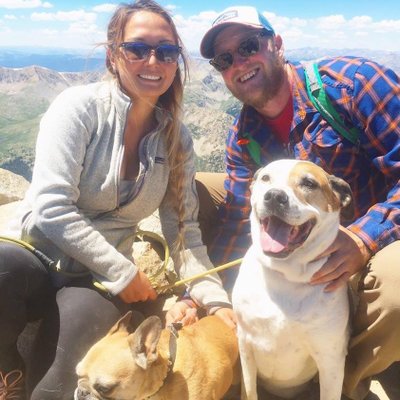 Results image of founder Making Sense of Cents with husband and dogs