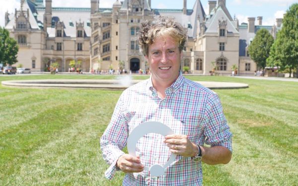 Results image of President Richard Schneider holding Eclipse antenna