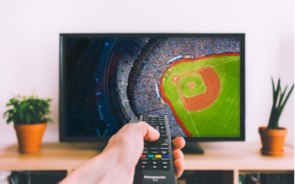 Results image of person pointing remote at TV