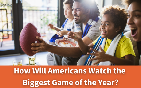 How will Americans Watch the Big Game? Family sitting on the couch watching Football game
