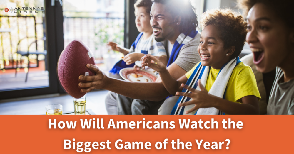 How will Americans Watch the Big Game? Family sitting on the couch watching Football game