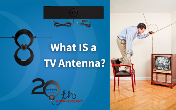 What is a TV antenna blog, Richard standing on chair with an old pair of rabbit ear antennas